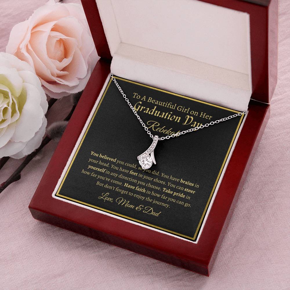 To A Beautiful Girl On Her Graduation Day - Ribbon Necklace - Love Mom & Dad Alluring Beauty Necklace